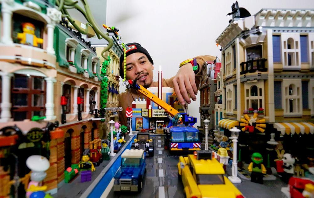 Children building together with colorful LEGO bricks